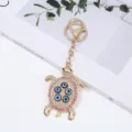 Evil eye turtle keychain with sparkling rhinestones and blue beads, stylish alloy bag charm pendant. - Rhinestone Turtle / 1 Piece / Pink