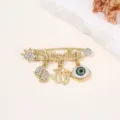 Broche strass mauvais œil dorée avec Masallah et pendentifs pour pull de mode femme. - Style C / 5.8x4.5x0.9cm