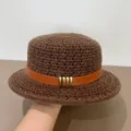 Brown knitted flat top hat detail view, featuring leather strap and brass metal buckles. - M (56-58cm) / Coffee