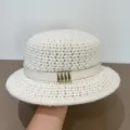 Detailed view of the white knitted flat-top hat featuring a chic leather strap and metal buckle. - M (56-58cm) / White