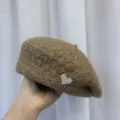 Brown knitted beret for women, stylish winter woolen painter hat featuring pearl heart brooch. - Camel