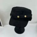 Black suede flat top hat detail showing vintage metal buttons and stylish street fashion design. - M (56-58cm) / Black
