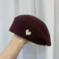 Wine red woolen beret detail featuring a delicate pearl heart accessory for women winter wear. - Red