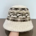 Close-up detail of the fuzzy knitted bucket hat featuring a cozy winter ethnic pattern. - M (56-58cm) / Beige