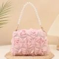 Elegant pink fabric rose handbag featuring pearl handle and metal chain for evening parties. - Pink