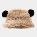 Detailed close-up of fluffy faux fur bucket hat with cute black bear ears, winter warm. - One Size / Khaki
