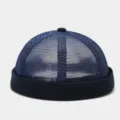 Dark blue mesh docker hat close-up showing breathable fabric texture and solid color rolled cuff design. - Adjustable / Navy Blue