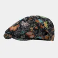 Detailed view of retro butterfly jacquard flat cap, showcasing colorful woven floral patterns. - Black