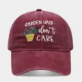Detailed view of a vintage washed burgundy baseball cap with cute garden floral embroidery text. - Adjustable / Burgundy