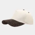 Close-up detail of the stylish leopard print brim on the casual off-white baseball cap. - Adjustable / Small Leopard Brim