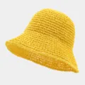 Detail view of a vibrant yellow straw bucket hat, featuring a breathable woven design for summer. - One Size / Yellow