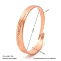 Detail view of copper open cuff bracelet with leaf texture and dimension measurements. - Leaf Style Copper Bangle