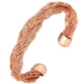 Detailed view of a woven copper cuff bracelet, adjustable open design with smooth end caps. - Multi-Strand Fine Intertwined Style (6563)