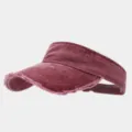 Detailed view of the washed distressed sun visor in dark red, showing frayed edge texture and fabric. - Adjustable / Washed Wine Red
