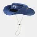 Close-up blue sun bucket hat detail, NYC embroidery, breathable mesh and adjustable chin cord. - Dark Blue