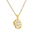 Gold stainless steel necklace detail showing mother of pearl irregular letter C pendant. - Letter C