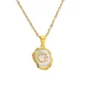 Close-up detail of gold stainless steel necklace featuring mother-of-pearl letter G pendant. - Letter G