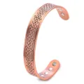 Close-up detail of the vintage copper magnetic bangle bracelet showcasing intricate Celtic knots. - 12 Magnets Bracelet