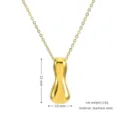 Detailed view of the golden stainless steel puffy bean pendant necklace, showing size and weight. - Gold I