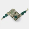Detailed closeup of the wide replacement bag strap with chic chevron pattern and metal hardware. - Light Gold Buckle / Green