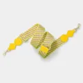 Detailed view of the yellow geometric wide replacement bag strap with metal adjustable buckle and clips. - Light Gold Buckle / Yellow