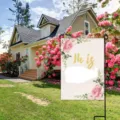 Easter garden flag detail showcasing pink rose floral pattern and religious holiday decoration outdoors. - Pink Rose Flowers (HYQ71-11)