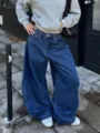 Detailed shot of dark blue washed baggy wide-leg denim jeans, loose fit street style. - S / Bottoms / Dark Blue