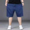 Pantaloncini jeans uomo taglie forti vestibilità larga casual gamba dritta blu estate. - 29 / Pantaloni e gonne / Blu scuro