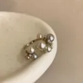 Elegant multi-pearl cluster ring featuring mixed-size pearls and sparkling stones. - Style R-1202-C Ring (R-1202-C)