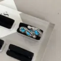 Detail shot of a Y2K blue zircon open ring with abstract silver metal fluid design. - Streamlined Micro-inlaid Rhinestone / Blue
