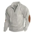 Close-up of men's half-zip ribbed sweatshirt featuring stand collar and brown elbow patches. - S / Light Gray