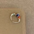 Handmade wire wrapped ring with colorful beads, detailed closeup view for women's fashion jewelry. - Blue Red Green Patterned Beads Style