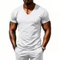 Close-up detail of men's white athletic mesh V-neck short sleeve t-shirt for fitness workout. - S / Tops / White
