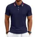 Detail view of the men's navy polo shirt featuring red and white collar design details. - S / Navy Blue