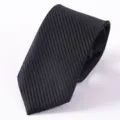 Detailed close-up view of a classic black striped men's business tie with fine texture. - Style 03