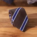 Close-up detail of the vintage striped necktie showcasing fine texture and classic business style. - Brown Broad Stripe Zipper Style