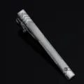 Detailed close-up of a sleek silver men's tie clip featuring geometric chevron patterns. - Silver 08 Style