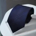 Dark blue patterned necktie close-up, premium formal business style texture detail. - Zipper Style / Navy Double Striped