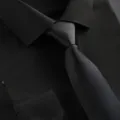 Classic black business shirt and tie detail view, elegant men's formal wear for professional use. - Solid Textured Black Zipper Tie