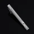 Detailed closeup of mens silver tie clip, featuring frosted finish, diagonal stripes and crystal. - Silver 10 Style