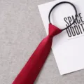 Detail shot of a red zipper tie, easy-to-wear lazy tie with clear twill texture design. - Style 021
