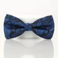 Blue and black paisley bow tie for men, classic British style wedding accessory detail. - Elegant Blue Paisley Bowtie