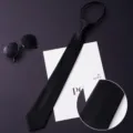 Men's black business zipper necktie detail showing fine twill fabric texture and design. - Color 015