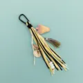 DIY tassel leather cord bag charm with strawberry and shell pendants, stylish bag accessory. - Black Hook Mixed Color Strawberry Tassel (B415-2) / Black White Yellow Braided Style