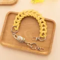 Sangle de sac tressee en cuir PU jaune avec fermoirs metalliques et perle style marbre. - Taille 40cm / Jaune
