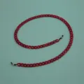 Detailed view of a stylish red acrylic glasses chain with secure rubber loops for daily wear. - Two-tone Wine Red