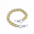 Detail shot of metal chain with yellow acrylic beads and metal clasps for DIY bag accessories. - B109 Yellow