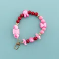 Candy color beaded phone charm lanyard with cute rabbit, bow and heart charms for sweet style. - X106-9