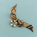 Close-up detail of the creative silk scarf beaded keychain accessory with wooden beads. - B346-Q (Chain Belt Print)