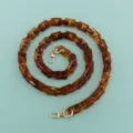 Dettaglio catena in tartaruga acrilica, perfetta tracolla fai da te per borse e accessori - Caffè